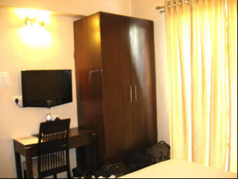 Hotel The Elite Suites Pune Quarto foto