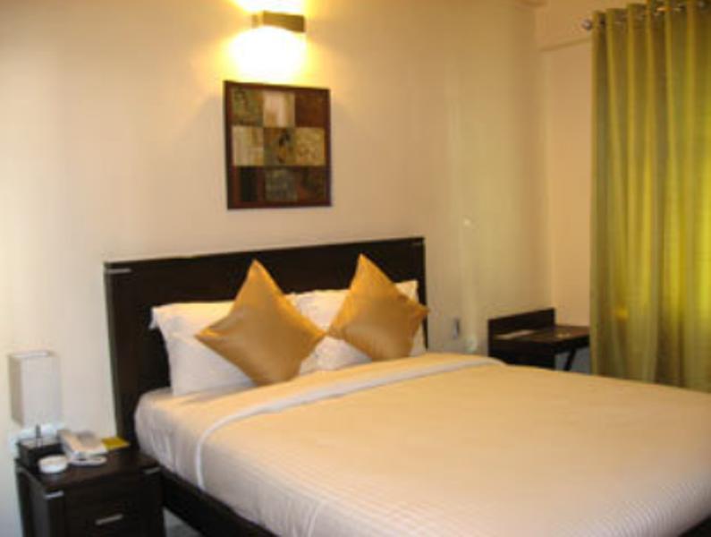Hotel The Elite Suites Pune Quarto foto