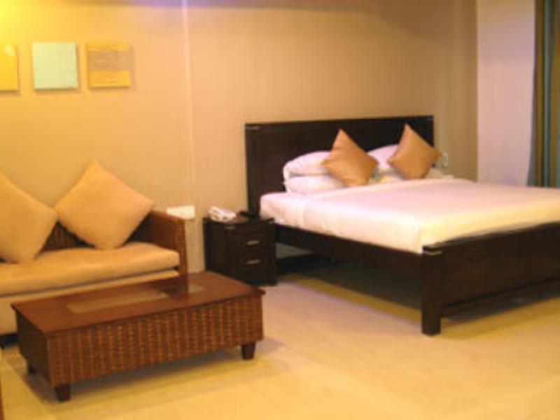 Hotel The Elite Suites Pune Quarto foto