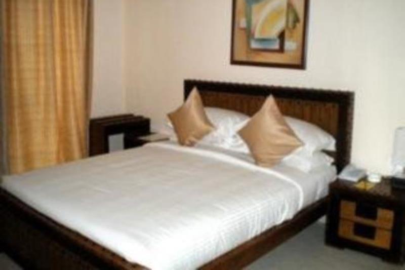 Hotel The Elite Suites Pune Quarto foto