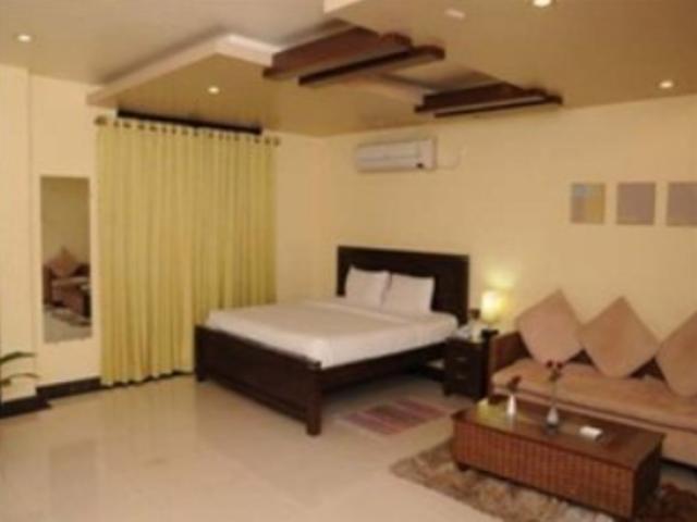 Hotel The Elite Suites Pune Quarto foto