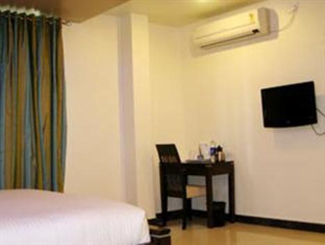 Hotel The Elite Suites Pune Quarto foto