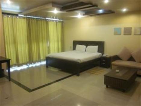 Hotel The Elite Suites Pune Quarto foto